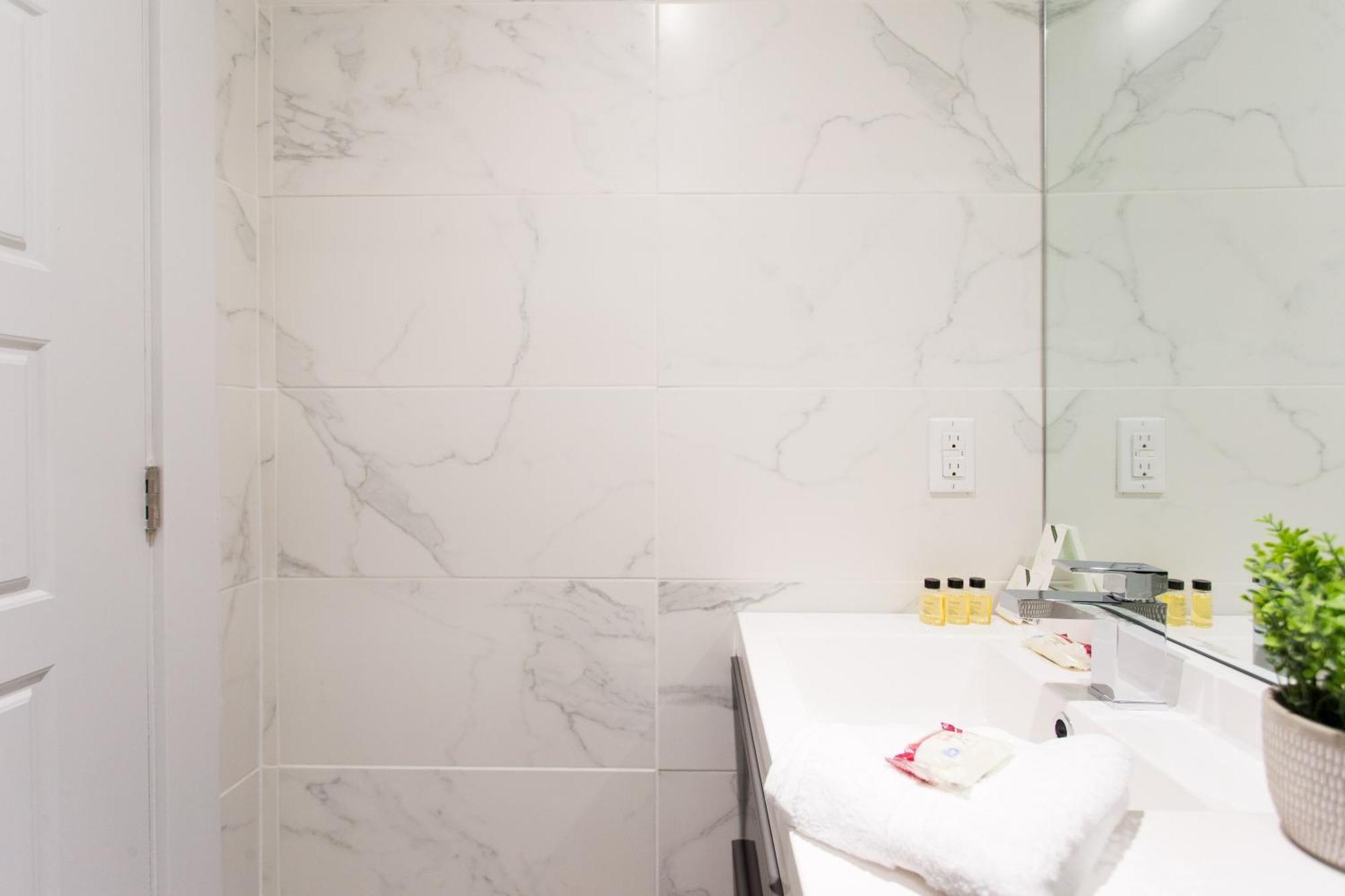 Serene And Styled Little Italy Full Bath By Den *